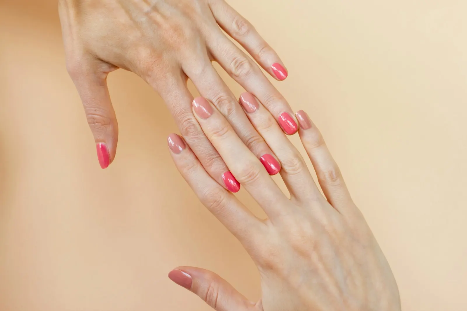 Illustrative pink manicure; not work by Acrylics by Fletch